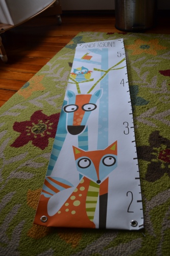 hanging this growth chart that we received as a gift